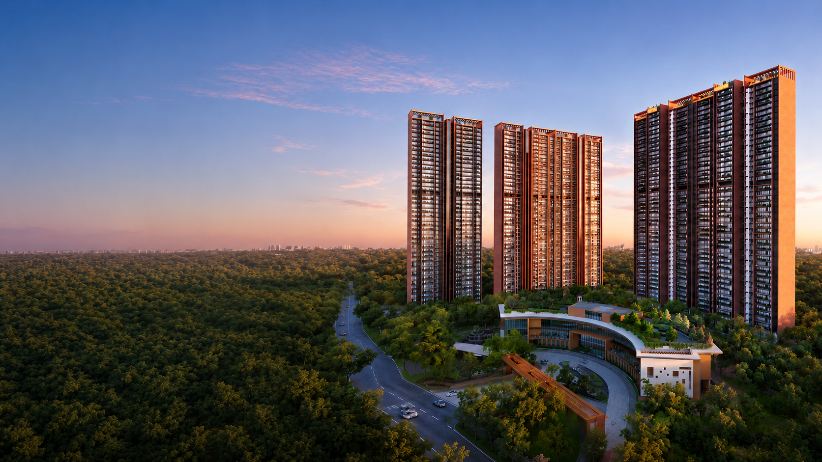 Sobha Aranya towers rising beside the Karma Lakelands forest at dusk